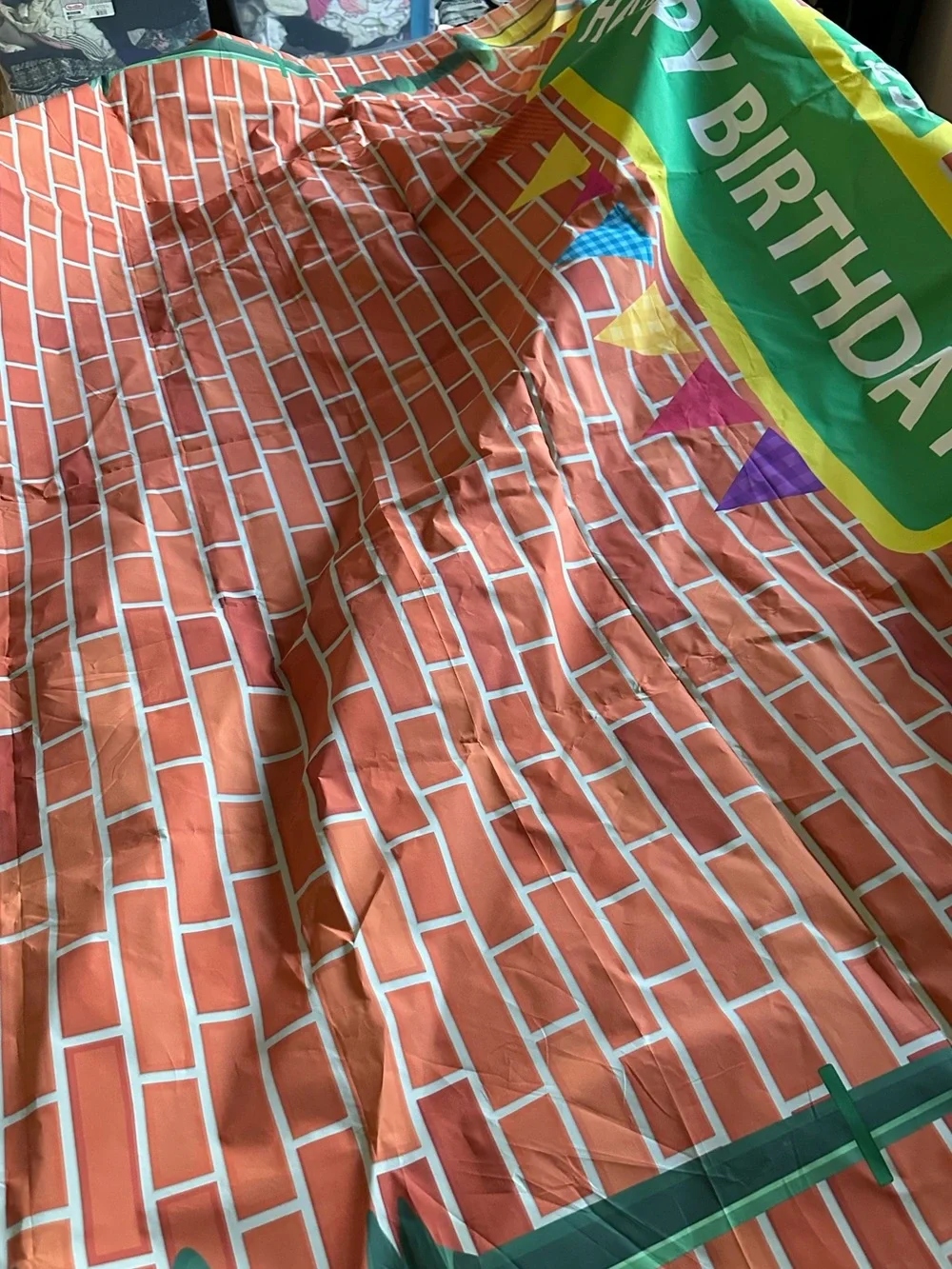 Happy Birthday Brick Wall Table Cover in Orange and Green. Sesame Street themed